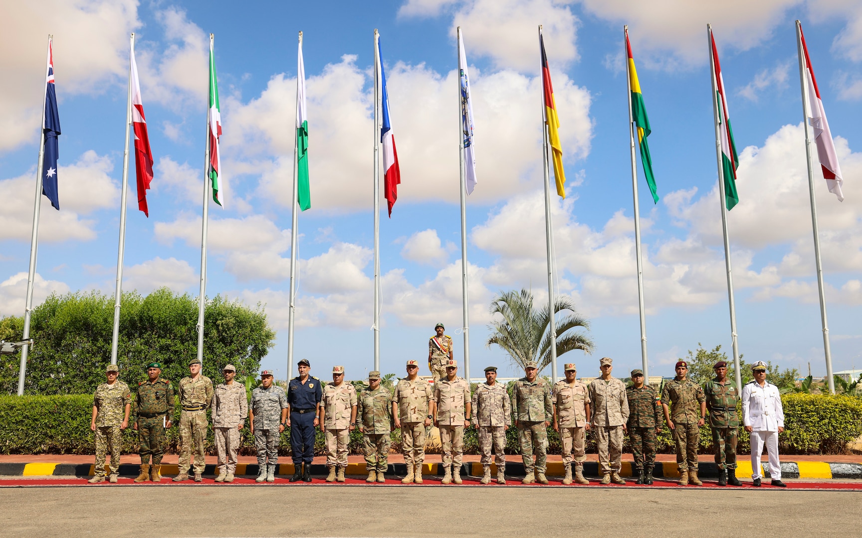 Partner nation military leaders stand together during the Bright Star 25 opening ceremony at Mohamed Naguib Military Base (MNMB), Egypt, Aug. 28, 2025. Exercise Bright Star 25 is a multilateral U.S. Central Command (USCENTCOM) command-post exercise, field training exercise and senior leader seminar, held in the Arab Republic of Egypt along with other partner nations. Participation strengthens military-to-military relationships between U.S. forces and our Egyptian partners in the USCENTCOM area of responsibility, as well as other participating nations. The exercise enhances regional security and stability by responding to modern-day security scenarios. (U.S. Marine Corps photo by Sgt. Angela Wilcox)