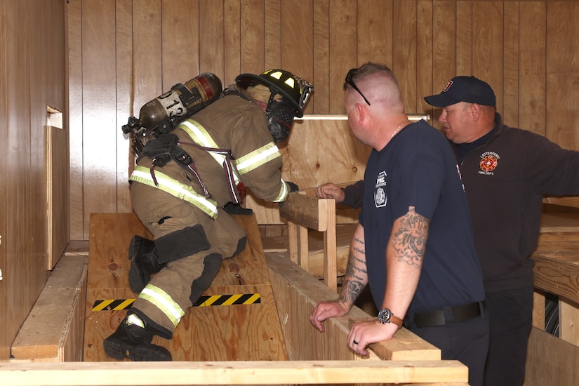 A Letterkenny Army Depot firefighter, wearing a mask that makes him completely blind, navigates his way through a course during firefighter training at the LEAD multi-purpose training facility on May 29.