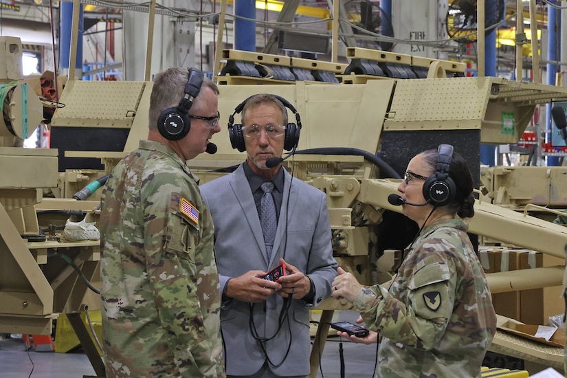 Lt. Gen. Chris Mohan (left), Army Materiel Command deputy commanding general and AMC acting commander, and Maj. Gen. Lori Robinson (right), Army Aviation and Missile Command commanding general, along with Dale McClanahan, Letterkenny Army Depot Future Systems Integration Office chief, discuss depot capabilities during a tour of the depot on August 12.