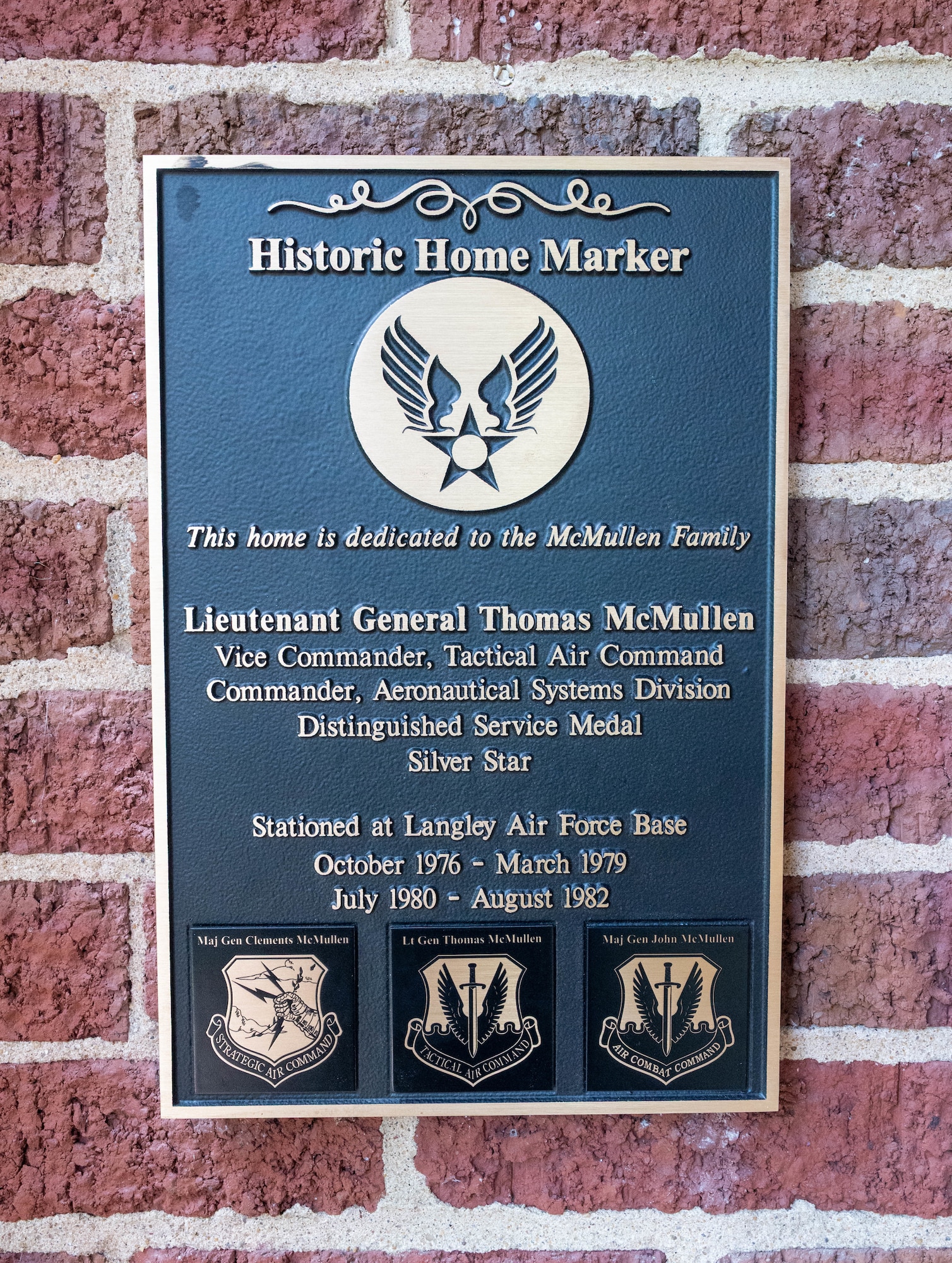 A historic marker designating the McMullin House hangs outside 140 Benedict Avenue