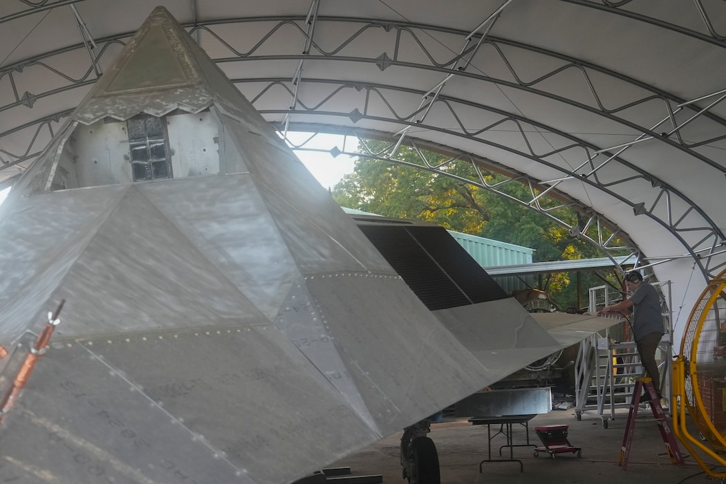 Employee riveting F-117 Blackhawk