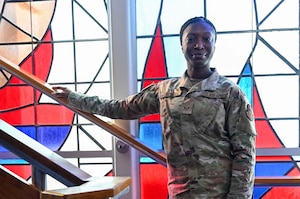 U.S. Air Force Staff Sgt Kiyana Pittman, Religious Affairs noncomissioned officer in charge of religious affairs with the 42d Air Base Wing Chapel Corps, advises Tech. Sgt. Karsten Seale, 42d Comptroller Squadron noncomissioned officer in charge of financial operations, at the Maxwell Air Force Base Chapel, Aug. 26, 2025. In her role, Pittman ensures that chapel volunteers have the necessary tools to assist with community events. (U.S. Air Force Photo by Senior Airman Tanner Doerr)