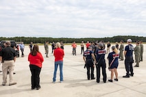 Kert Lang, an emergency manager from Marine Corps Air Station (MCAS) New River, provides an exercise overview for U.S. Marines and civilians from MCAS New River and Marine Medium Tiltrotor Squadron (VMM) 365 alongside first responders from neighboring communities during an aircraft mishap exercise at Marine Corps Outlying Landing Field Camp Davis on Marine Corps Base Camp Lejeune, North Carolina, Aug. 28, 2025.