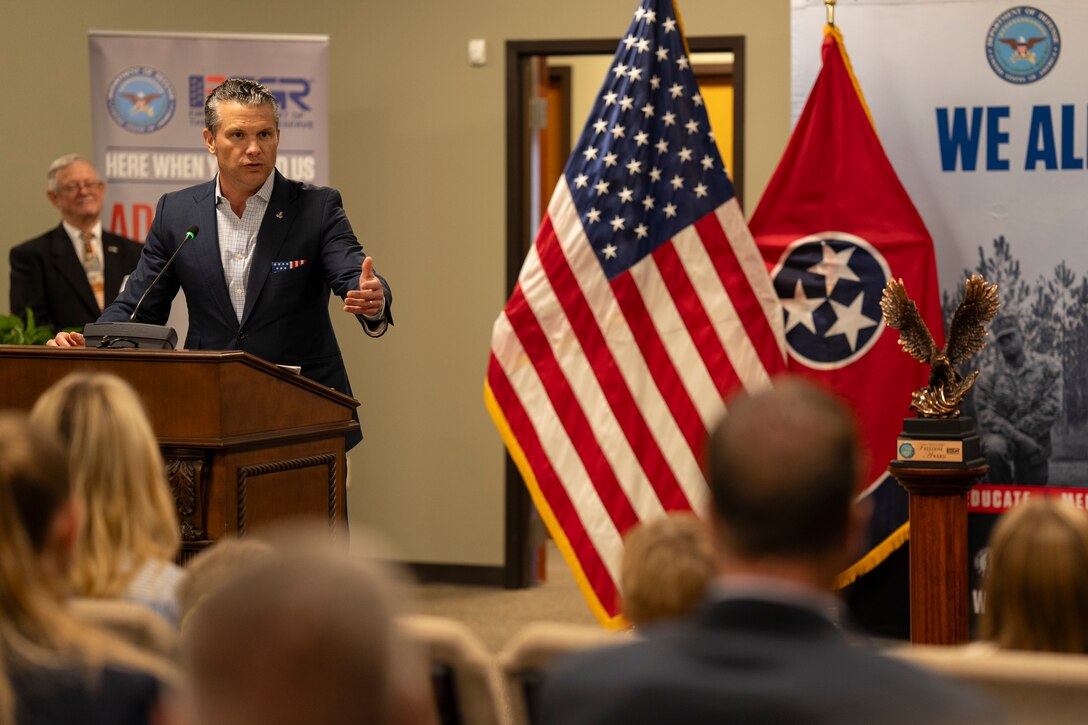 The defense secretary delivers remarks to an audience.