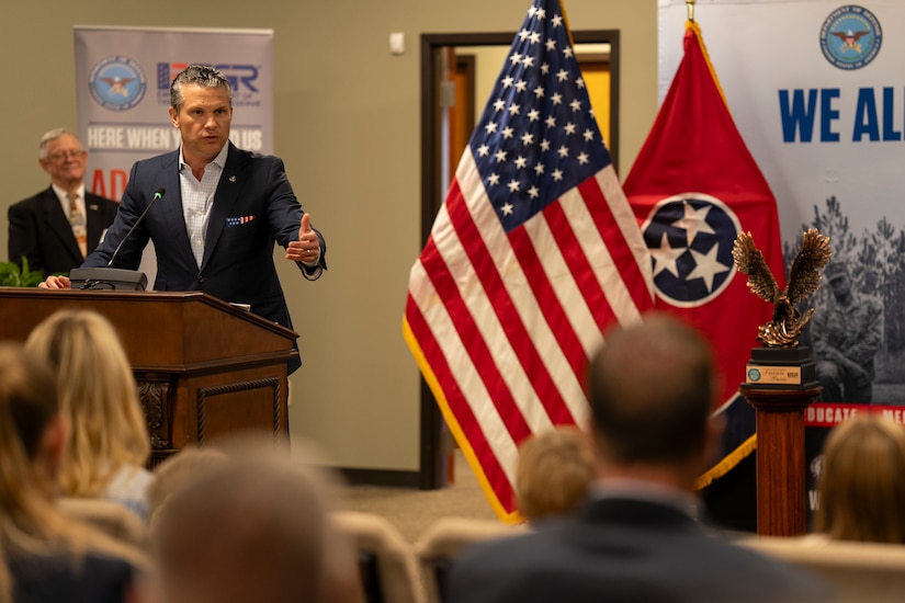 The defense secretary delivers remarks to an audience.