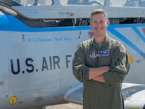 Puccia poses for photo in front of 39th FTS Cobras flagship T-6A Texan II