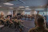 U.S. Army Maj. Matthew Gurniak, Strategic Planner with the Joint Staff, briefs a joint group of officers and senior enlisted service members at the D.C. Armory, Washington, D.C., Aug. 17, 2025. The discussion focused on increasing National Guard presence in support of the D.C. Safe and Beautiful Task Force.