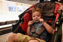 A child holds an Army nametape at Metro Center station in Washington, D.C., on August 23, 2025. Approximately 2,200 National Guard service members comprise JTF-DC to support the DC Safe and Beautiful Taskforce. These National Guard service members provide critical support such as crowd management, perimeter control, logistics and communications in support of law enforcement.
