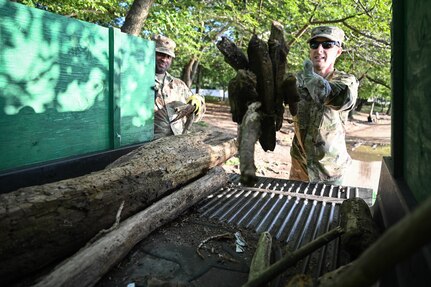 U.S. Army Col. Christopher York, right, commander, Task Force Beautification, and a fellow Soldier with the District of Columbia Army National Guard collect trash along the Tidal Basin near the Martin Luther King Jr. Memorial in Washington, D.C., Aug. 25, 2025. About 2,000 National Guard members are supporting the D.C. Safe and Beautiful mission, providing critical support to the D.C. Metropolitan Police Department in ensuring the safety of all who live, work and visit the District.