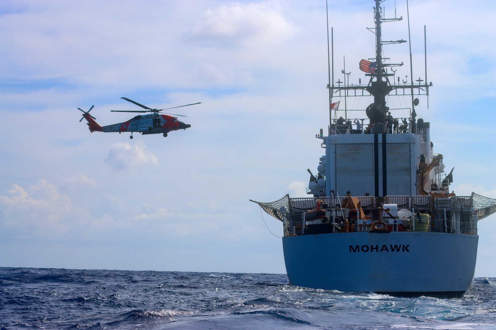 Coast Guard Cutter Mohawk (WMEC 913) and a Coast Guard MH-60 Jayhawk helicopter air crew conduct flight training evolutions in the Caribbean Sea, July 15, 2025. Mohawk’s crew conducted a 75-day maritime border security patrol in the Caribbean Sea, Florida Straits and Caribbean Sea. (U.S. Coast Guard photo by Seaman Corrie Gill)