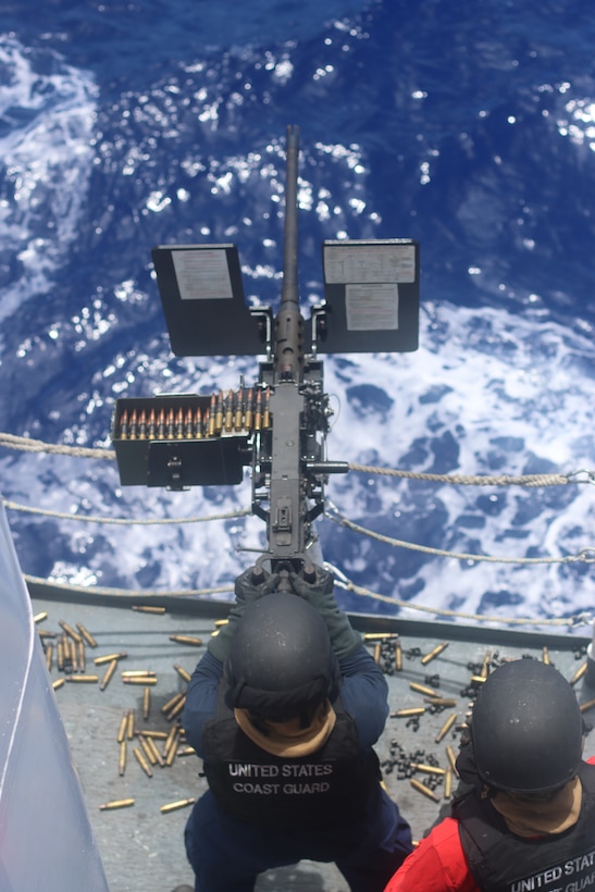 Coast Guard Cutter Mohawk (WMEC 913) crew members conduct a gunnery exercise on the cutter's .50-caliber machine gun while underway in the Caribbean Sea, July 23, 2025. Mohawk’s crew conducted a 75-day maritime border security patrol in the Caribbean Sea, Florida Straits, and Caribbean Sea. (U.S. Coast Guard photo by Ensign Andrew Ferderer)