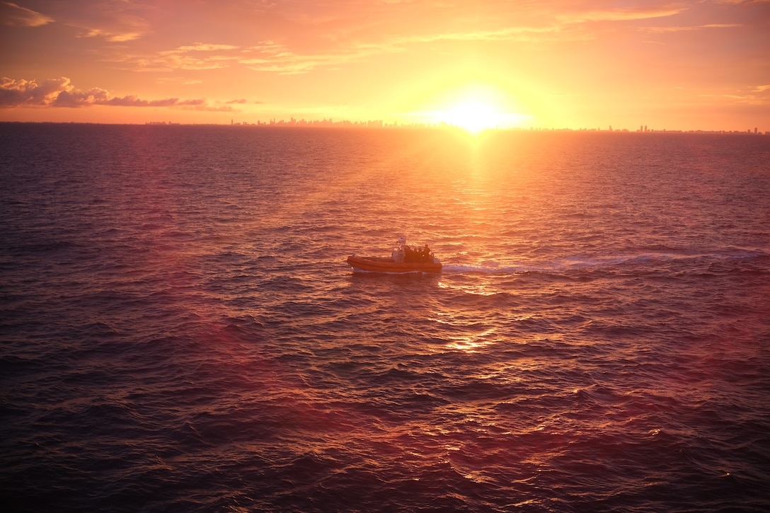 The Coast Guard Cutter Mohawk's (WMEC 913) 26-foot, Mk-V over-the-horizon cutter boat, the service's newest, transits at sunset off Miami, Florida, Aug. 7, 2025. Mohawk’s crew conducted a 75-day maritime border security patrol in the Caribbean Sea, Florida Straits, and Caribbean Sea. (U.S. Coast Guard photo by Ensign Andrew Federer)