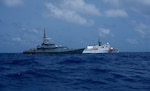 Coast Guard Cutter Mohawk (WMEC 913) crew members conduct a gunnery exercise on the cutter's .50-caliber machine gun while underway in the Caribbean Sea, July 23, 2025. Mohawk’s crew conducted a 75-day maritime border security patrol in the Caribbean Sea, Florida Straits, and Caribbean Sea. (U.S. Coast Guard photo by Ensign Andrew Ferderer)