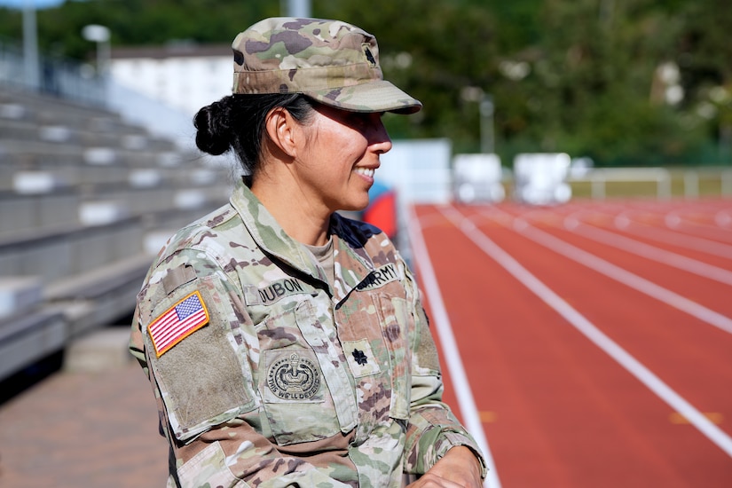 Lt. Col. Juanita Dubon, an Army nurse practitioner, volunteers with Kaiserslautern High School athletes during a football practice in Kaiserslautern, Germany. Dubon, along with Staff Sgt. Stephen Burkham, is credited with saving a student’s life during a game last fall.