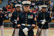 U.S. Marine Corps Staff Sgt. Zackery Cox, platoon sergeant, United States Marine Corps Silent Drill Platoon, stands at "ceremonial at-ease" before a performance for the students of Parkview High School during Marine Week Atlanta in Lilburn, Ga., Aug. 29, 2025. The year 2025 marks the 250th anniversary of the United States Marine Corps, a milestone that highlights the legacy, transformation and enduring spirit of the Corps since 1775. Throughout the year, Marines across the globe will commemorate this anniversary by honoring the service and sacrifice of those who served before them and by remaining faithful to the motto Semper Fidelis. (U.S. Marine Corps photo by Cpl. Christopher Prelle)