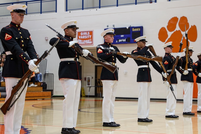 U.S. Marines with the United States Marine Corps Silent Drill Platoon execute their "long line" sequence during a performance for the students of Parkview High School during Marine Week Atlanta in Lilburn, Ga., Aug. 29, 2025. The year 2025 marks the 250th anniversary of the United States Marine Corps, a milestone that highlights the legacy, transformation and enduring spirit of the Corps since 1775. Throughout the year, Marines across the globe will commemorate this anniversary by honoring the service and sacrifice of those who served before them and by remaining faithful to the motto Semper Fidelis. (U.S. Marine Corps photo by Cpl. Christopher Prelle)
