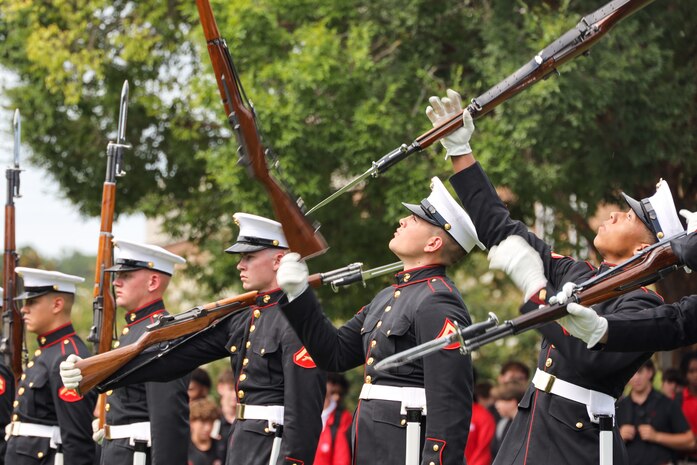 U.S. Marines with the United States Marine Corps Silent Drill Platoon execute their "long line" sequence during a performance for the students of Greater Atlanta Christian High School during Marine Week Atlanta in Norcross, Ga., Aug. 28, 2025. The year 2025 marks the 250th anniversary of the United States Marine Corps, a milestone that highlights the legacy, transformation and enduring spirit of the Corps since 1775. Throughout the year, Marines across the globe will commemorate this anniversary by honoring the service and sacrifice of those who served before them and by remaining faithful to the motto Semper Fidelis. (U.S. Marine Corps photo by Cpl. Christopher Prelle)