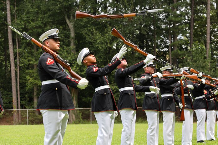 U.S. Marines with the United States Marine Corps Silent Drill Platoon execute their "long line" sequence during a performance for the students of Cross Keys High School during Marine Week Atlanta in Brookhaven, Ga., Aug. 28, 2025. The year 2025 marks the 250th anniversary of the United States Marine Corps, a milestone that highlights the legacy, transformation and enduring spirit of the Corps since 1775. Throughout the year, Marines across the globe will commemorate this anniversary by honoring the service and sacrifice of those who served before them and by remaining faithful to the motto Semper Fidelis. (U.S. Marine Corps photo by Cpl. Christopher Prelle)