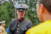 U.S. Marine Corps Lance Cpl. Culver Switzer, rifleman, United States Marine Corps Silent Drill Platoon, speaks with students following a performance for the students of Cross Keys High School during Marine Week Atlanta in Brookhaven, Ga., Aug. 28, 2025. The year 2025 marks the 250th anniversary of the United States Marine Corps, a milestone that highlights the legacy, transformation and enduring spirit of the Corps since 1775. Throughout the year, Marines across the globe will commemorate this anniversary by honoring the service and sacrifice of those who served before them and by remaining faithful to the motto Semper Fidelis. (U.S. Marine Corps photo by Cpl. Christopher Prelle)