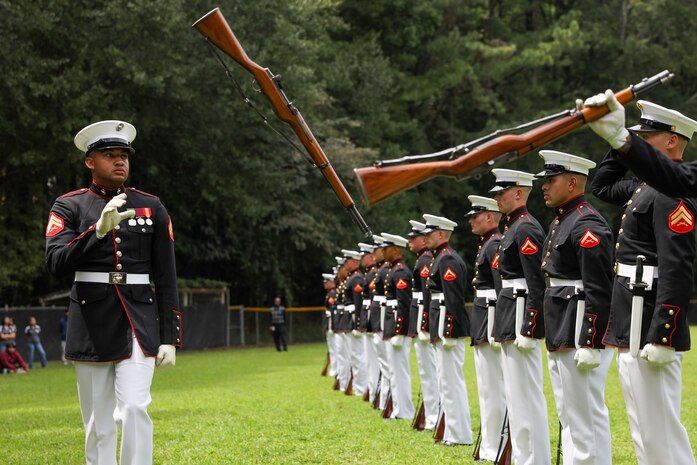 U.S. Marines with the United States Marine Corps Silent Drill Platoon execute their "long line" sequence during a performance for the students of Cross Keys High School during Marine Week Atlanta in Brookhaven, Ga., Aug. 28, 2025. The year 2025 marks the 250th anniversary of the United States Marine Corps, a milestone that highlights the legacy, transformation and enduring spirit of the Corps since 1775. Throughout the year, Marines across the globe will commemorate this anniversary by honoring the service and sacrifice of those who served before them and by remaining faithful to the motto Semper Fidelis. (U.S. Marine Corps photo by Cpl. Christopher Prelle)