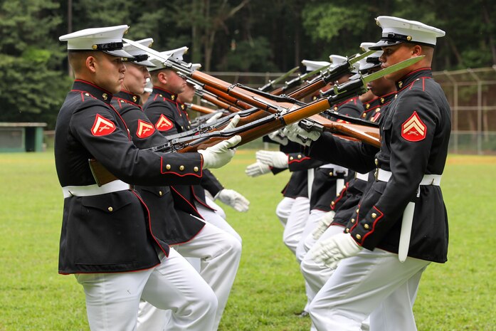 U.S. Marines with the United States Marine Corps Silent Drill Platoon execute their opening sequence during a performance for the students of Cross Keys High School during Marine Week Atlanta in Brookhaven, Ga., Aug. 28, 2025. The year 2025 marks the 250th anniversary of the United States Marine Corps, a milestone that highlights the legacy, transformation and enduring spirit of the Corps since 1775. Throughout the year, Marines across the globe will commemorate this anniversary by honoring the service and sacrifice of those who served before them and by remaining faithful to the motto Semper Fidelis. (U.S. Marine Corps photo by Cpl. Christopher Prelle)