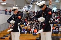 U.S. Marines with the United States Marine Corps Silent Drill Platoon execute their "double inspection" sequence during a performance for the students of Parkview High School during Marine Week Atlanta in Lilburn, Ga., Aug. 29, 2025. The year 2025 marks the 250th anniversary of the United States Marine Corps, a milestone that highlights the legacy, transformation and enduring spirit of the Corps since 1775. Throughout the year, Marines across the globe will commemorate this anniversary by honoring the service and sacrifice of those who served before them and by remaining faithful to the motto Semper Fidelis. (U.S. Marine Corps photo by Cpl. Christopher Prelle)