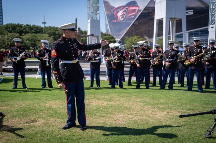 U.S. Marine Corps Sgt. Taylor Brown, a musician with the 2D Marine Aircraft Wing Band, assigned to Special Purpose Marine Air-Ground Task Force-250, introduces his ensemble during Marine Week Atlanta, Aug. 31, 2025. Marines stationed across the globe commemorate the 250th anniversary of the Marine Corps, honoring a distinguished legacy of service, sacrifice, and unwavering fidelity to both the nation and fellow Marines. (U.S. Marine Corps photo by Sgt. Alfonso Livrieri)