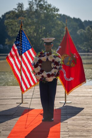 A U.S. Marine assigned to Special Purpose Marine Air-Ground Task Force-250, hold a wreath during a wreath laying ceremony held by Special Purpose Marine Air-Ground Task Force-250 at Piedmont Park during Marine Week Atlanta, Aug. 31, 2025. The solemn tribute served to commemorate Marines who made the ultimate sacrifice in defense of our nation during Vietnam. Marines stationed across the globe commemorate the 250th anniversary of the Marine Corps, honoring a distinguished legacy of service, sacrifice, and unwavering fidelity to both the nation and fellow Marines. (U.S. Marine Corps photo by Sgt. Alfonso Livrieri)