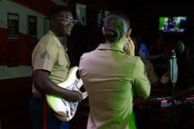U.S. Marine Corps Sgt. Elizabeth Marino, (right) a vocalist, and Cpl. Noel Jabari, a guitarist with the 2D Marine Aircraft Wing Band with the popular music group, assigned to Special Purpose Marine Air-Ground Task Force-250 perform at Cobb County, Georgia during Marine Week Atlanta, Aug. 30, 2025. Marines stationed across the globe commemorate the 250th anniversary of the Marine Corps, honoring a distinguished legacy of service, sacrifice, and unwavering fidelity to both the nation and the Corps. (U.S. Marine Corps photo by Lance Cpl. Steven Wells)