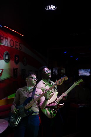 U.S. Marine Corps Cpl. Anthony Russo,(Left) and Cpl. Noel Jabari, musicians with the 2D Marine Aircraft Wing Band with the popular music group, assigned to Special Purpose Marine Air-Ground Task Force-250 perform at Cobb County, Georgia during Marine Week Atlanta, Aug. 30, 2025. Marines stationed across the globe commemorate the 250th anniversary of the Marine Corps, honoring a distinguished legacy of service, sacrifice, and unwavering fidelity to both the nation and the Corps. (U.S. Marine Corps photo by Lance Cpl. Steven Wells)