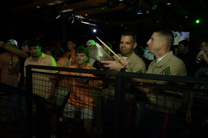 U.S. Marines assigned to Special Purpose Marine Air-Ground Task Force-250 and civilians watch a performance from the 2D Marine Aircraft Wing Band with the popular music group, at Cobb County, Georgia during Marine Week Atlanta, Aug. 30, 2025. Marines stationed across the globe commemorate the 250th anniversary of the Marine Corps, honoring a distinguished legacy of service, sacrifice, and unwavering fidelity to both the nation and the Corps. (U.S. Marine Corps photo by Lance Cpl. Steven Wells)