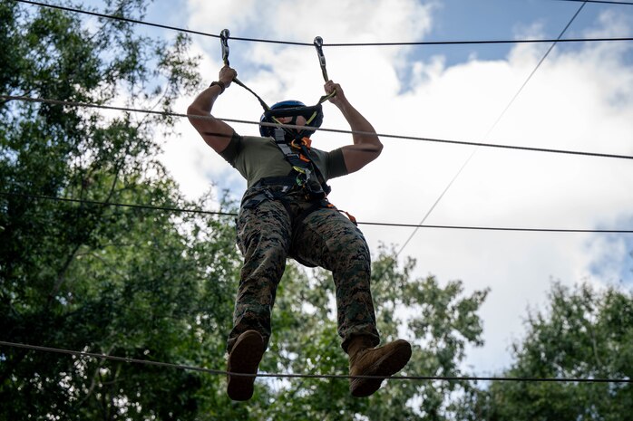 A U.S. Marine assigned to Special Purpose Marine Air-Ground Task Force 250 takes part in the confidence course at Camp Southern Ground, Fayetteville, Georgia during Marine Week Atlanta, Aug. 30, 2025. Marines stationed across the globe commemorate the 250th anniversary of the Marine Corps, honoring a distinguished legacy of service, sacrifice, and unwavering fidelity to both the nation and the Corps. (U.S. Marine Corps photo by Sgt. Alexis French)