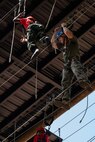 U.S. Marine Corps Capt. Jack Nance, an infantry officer assigned to Special Purpose Marine Air-Ground Task Force 250, and Young Marines from Middle Georgia Young Marines Program take part in the confidence course at Camp Southern Ground, Fayetteville, Georgia during Marine Week Atlanta, Aug. 30, 2025. Marines stationed across the globe commemorate the 250th anniversary of the Marine Corps, honoring a distinguished legacy of service, sacrifice, and unwavering fidelity to both the nation and the Corps. (U.S. Marine Corps photo by Sgt. Alexis French)