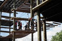 U.S. Marines assigned to Special Purpose Marine Air-Ground Task Force 250 take part in the confidence course at Camp Southern Ground, Fayetteville, Georgia during Marine Week Atlanta, Aug. 30, 2025. Marines stationed across the globe commemorate the 250th anniversary of the Marine Corps, honoring a distinguished legacy of service, sacrifice, and unwavering fidelity to both the nation and the Corps. (U.S. Marine Corps photo by Sgt. Alexis French)