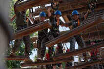 U.S. Marines assigned to Combat Logistics Regiment 45, take part in the confidence course at Camp Southern Ground during Marine Week Atlanta, Aug. 30, 2025. Marines stationed across the globe commemorate the 250th anniversary of the Marine Corps, honoring a distinguished legacy of the service, sacrifice, and unwavering fidelity to both the nation and fellow Marines. (U.S. Marine Corps photo by Lance Cpl. Matthew A. McDonnell)