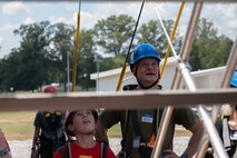 U.S. Marine Corps Capt. Jack Nance, an infantry officer assigned to Combat Logistics Regiment 45, takes part in the confidence course at Camp Southern Ground during Marine Week Atlanta, Aug. 30, 2025. Marines stationed across the globe commemorate the 250th anniversary of the Marine Corps, honoring a distinguished legacy of the service, sacrifice, and unwavering fidelity to both the nation and fellow Marines. (U.S. Marine Corps photo by Lance Cpl. Matthew A. McDonnell)