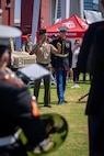 U.S. Marine Corps Sgt. Taylor Brown, right, a musician with the 2D Marine Aircraft Wing Band, assigned to Special Purpose Marine Air-Ground Task Force-250, teaches a member of the Young Marines how to conduct the band during Marine Week Atlanta, Aug. 31, 2025. Marines stationed across the globe commemorate the 250th anniversary of the Marine Corps, honoring a distinguished legacy of service, sacrifice, and unwavering fidelity to both the nation and fellow Marines. (U.S. Marine Corps photo by Sgt. Alfonso Livrieri)