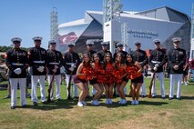 The U.S. Marine Corps Silent Drill Platoon, assigned to Special Purpose Marine Air-Ground Task Force-250, pose for a photo with cheerleaders from Virginia Tech during Marine Week Atlanta, Aug. 31, 2025. Marines stationed across the globe commemorate the 250th anniversary of the Marine Corps, honoring a distinguished legacy of service, sacrifice, and unwavering fidelity to both the nation and the Corps. (U.S. Marine Corps photo by Sgt. Alfonso Livrieri)