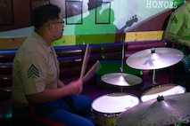 U.S. Marine Corps Sgt. Vicente Rodriquez, a drummer with the 2D Marine Aircraft Wing Band with the popular music group, assigned to Special Purpose Marine Air-Ground Task Force-250 performs at Cobb County, Georgia during Marine Week Atlanta, Aug. 30, 2025. Marines stationed across the globe commemorate the 250th anniversary of the Marine Corps, honoring a distinguished legacy of service, sacrifice, and unwavering fidelity to both the nation and the Corps. (U.S. Marine Corps photo by Lance Cpl. Steven Wells)