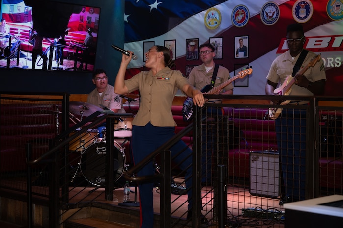 U.S. Marine Corps 2D Marine Aircraft Wing Band with the popular music group, assigned to Special Purpose Marine Air-Ground Task Force-250 perform at Cobb County, Georgia during Marine Week Atlanta, Aug. 30, 2025. Marines stationed across the globe commemorate the 250th anniversary of the Marine Corps, honoring a distinguished legacy of service, sacrifice, and unwavering fidelity to both the nation and the Corps. (U.S. Marine Corps photo by Lance Cpl. Steven Wells)