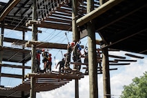 U.S. Marines assigned to Special Purpose Marine Air-Ground Task Force 250 take part in the confidence course at Camp Southern Ground, Fayetteville, Georgia during Marine Week Atlanta, Aug. 30, 2025. Marines stationed across the globe commemorate the 250th anniversary of the Marine Corps, honoring a distinguished legacy of service, sacrifice, and unwavering fidelity to both the nation and the Corps. (U.S. Marine Corps photo by Sgt. Alexis French)