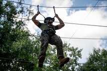 A U.S. Marine assigned to Special Purpose Marine Air-Ground Task Force 250 takes part in the confidence course at Camp Southern Ground, Fayetteville, Georgia during Marine Week Atlanta, Aug. 30, 2025. Marines stationed across the globe commemorate the 250th anniversary of the Marine Corps, honoring a distinguished legacy of service, sacrifice, and unwavering fidelity to both the nation and the Corps. (U.S. Marine Corps photo by Sgt. Alexis French)
