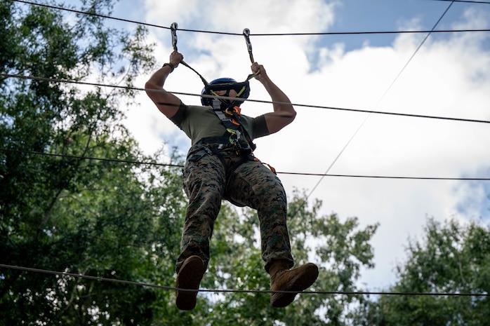 A U.S. Marine assigned to Special Purpose Marine Air-Ground Task Force 250 takes part in the confidence course at Camp Southern Ground, Fayetteville, Georgia during Marine Week Atlanta, Aug. 30, 2025. Marines stationed across the globe commemorate the 250th anniversary of the Marine Corps, honoring a distinguished legacy of service, sacrifice, and unwavering fidelity to both the nation and the Corps. (U.S. Marine Corps photo by Sgt. Alexis French)