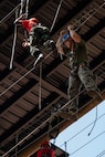 U.S. Marine Corps Capt. Jack Nance, an infantry officer assigned to Special Purpose Marine Air-Ground Task Force 250, and Young Marines from Middle Georgia Young Marines Program take part in the confidence course at Camp Southern Ground, Fayetteville, Georgia during Marine Week Atlanta, Aug. 30, 2025. Marines stationed across the globe commemorate the 250th anniversary of the Marine Corps, honoring a distinguished legacy of service, sacrifice, and unwavering fidelity to both the nation and the Corps. (U.S. Marine Corps photo by Sgt. Alexis French)