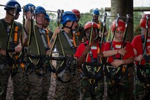 U.S. Marines assigned to Special Purpose Marine Air-Ground Task Force 250 and Young Marines from Middle Georgia Young Marines Program take part in the confidence course at Camp Southern Ground, Fayetteville, Georgia during Marine Week Atlanta, Aug. 30, 2025. Marines stationed across the globe commemorate the 250th anniversary of the Marine Corps, honoring a distinguished legacy of service, sacrifice, and unwavering fidelity to both the nation and the Corps. (U.S. Marine Corps photo by Sgt. Alexis French)
