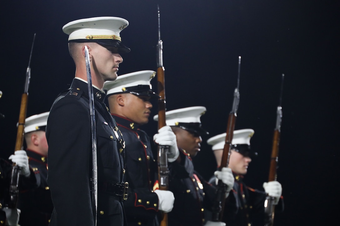 U.S. Marines with the United States Marine Corps Silent Drill Platoon execute their beginning sequence during a half-time performance at a Gainesville High School football game during Marine Week Atlanta in Gainesville, Ga., Aug. 29, 2025. The year 2025 marks the 250th anniversary of the United States Marine Corps, a milestone that highlights the legacy, transformation and enduring spirit of the Corps since 1775. Throughout the year, Marines across the globe will commemorate this anniversary by honoring the service and sacrifice of those who served before them and by remaining faithful to the motto Semper Fidelis. (U.S. Marine Corps photo by Cpl. Christopher Prelle)