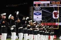 U.S. Marines with the United States Marine Corps Silent Drill Platoon execute their "long line" sequence during a half-time performance at a Gainesville High School football game during Marine Week Atlanta in Gainesville, Ga., Aug. 29, 2025. The year 2025 marks the 250th anniversary of the United States Marine Corps, a milestone that highlights the legacy, transformation and enduring spirit of the Corps since 1775. Throughout the year, Marines across the globe will commemorate this anniversary by honoring the service and sacrifice of those who served before them and by remaining faithful to the motto Semper Fidelis. (U.S. Marine Corps photo by Cpl. Christopher Prelle)