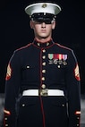 U.S. Marine Corps Sgt. William Buffington, rifle inspector, United States Marine Corps Silent Drill Platoon, stands at attention during a half-time performance at a Gainesville High School football game during Marine Week Atlanta in Gainesville, Ga., Aug. 29, 2025. The year 2025 marks the 250th anniversary of the United States Marine Corps, a milestone that highlights the legacy, transformation and enduring spirit of the Corps since 1775. Throughout the year, Marines across the globe will commemorate this anniversary by honoring the service and sacrifice of those who served before them and by remaining faithful to the motto Semper Fidelis. (U.S. Marine Corps photo by Cpl. Christopher Prelle)