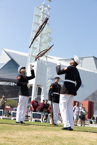 U.S. Marines with the Silent Drill Platoon  assigned to Marine Barracks Washington perform rifle drill during Marine Week Atlanta, Aug. 31, 2025. Marines stationed across the globe commemorate the 250th anniversary of the Marine Corps, honoring a distinguished legacy of service, sacrifice, and unwavering fidelity to both the nation and fellow Marines. (U.S. Marine Corps photo by Lance Cpl. Kiara Rawls)
