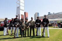 The U.S. Marine Corps Silent Drill Platoon, assigned to Special Purpose Marine Air-Ground Task Force-250, pose for a photo with members of the Young Marines program during Marine Week Atlanta, Aug. 31, 2025. Marines stationed across the globe commemorate the 250th anniversary of the Marine Corps, honoring a distinguished legacy of service, sacrifice, and unwavering fidelity to both the nation and the Corps. (U.S. Marine Corps photo by Lance Cpl. Kiara Rawls)